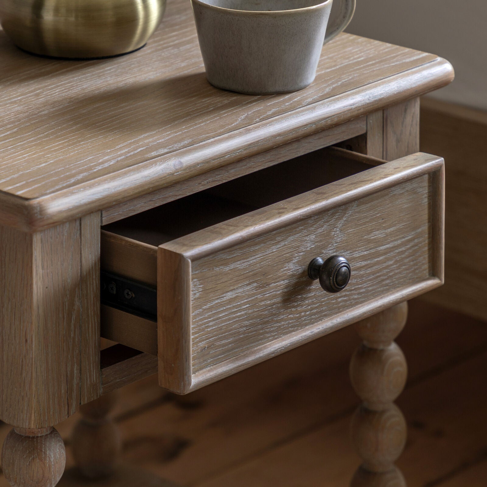 Turner 1 dawer bedside table in lime washed oak with hand turned bobbin detailing | malletandplane.com